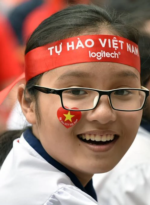 Nụ cười hoan hỷ của một cổ động viên - Ảnh: Trần Thế Phong